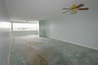 Spacious 2-bedroom 2 bath condo offers a good size kitchen with on Sunrise Lakes Phase IV Golf Course in Florida - for sale on GolfHomes.com, golf home, golf lot