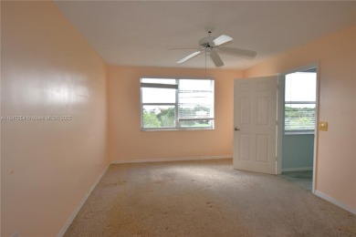 Spacious 2-bedroom 2 bath condo offers a good size kitchen with on Sunrise Lakes Phase IV Golf Course in Florida - for sale on GolfHomes.com, golf home, golf lot