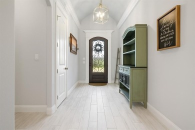 This exquisite four bedroom three bath Al Couto home boasts on Harbor Lakes Golf Club in Texas - for sale on GolfHomes.com, golf home, golf lot