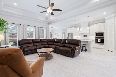 This exquisite four bedroom three bath Al Couto home boasts on Harbor Lakes Golf Club in Texas - for sale on GolfHomes.com, golf home, golf lot