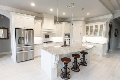 This exquisite four bedroom three bath Al Couto home boasts on Harbor Lakes Golf Club in Texas - for sale on GolfHomes.com, golf home, golf lot