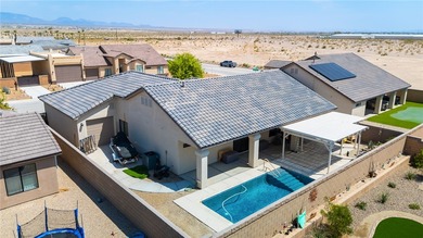 Welcome to this beautifully maintained 3-bedroom, 2-bath POOL on Desert Lakes Golf Course in Arizona - for sale on GolfHomes.com, golf home, golf lot