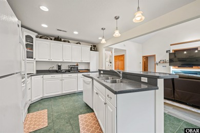 Don't miss out on this incredible canal-front home situated on on Duck Woods Country Club in North Carolina - for sale on GolfHomes.com, golf home, golf lot