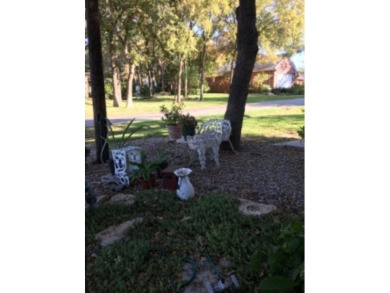 So much charm and character in this beautiful corner lot with a on De Cordova Bend Country Club in Texas - for sale on GolfHomes.com, golf home, golf lot