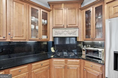 This stunning home in the prestigious gated with security guard on Whitewater Creek in Georgia - for sale on GolfHomes.com, golf home, golf lot