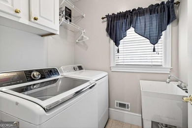 This stunning home in the prestigious gated with security guard on Whitewater Creek in Georgia - for sale on GolfHomes.com, golf home, golf lot