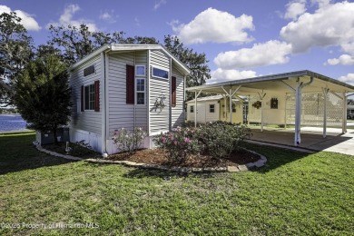 Welcome to paradise!  This lakefront home on Tooke Lake is on Glen Lakes Country Club in Florida - for sale on GolfHomes.com, golf home, golf lot