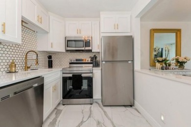 Renovated to perfection, this chic condominium in Lakeshore Club on The President Country Club in Florida - for sale on GolfHomes.com, golf home, golf lot