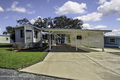 Welcome to paradise!  This lakefront home on Tooke Lake is on Glen Lakes Country Club in Florida - for sale on GolfHomes.com, golf home, golf lot