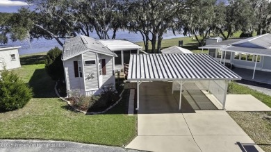 Welcome to paradise!  This lakefront home on Tooke Lake is on Glen Lakes Country Club in Florida - for sale on GolfHomes.com, golf home, golf lot