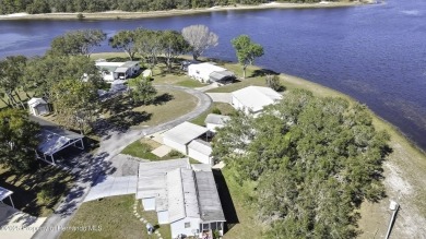 Welcome to paradise!  This lakefront home on Tooke Lake is on Glen Lakes Country Club in Florida - for sale on GolfHomes.com, golf home, golf lot