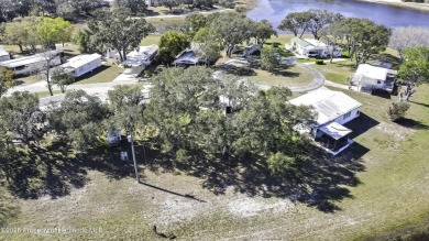 Welcome to paradise!  This lakefront home on Tooke Lake is on Glen Lakes Country Club in Florida - for sale on GolfHomes.com, golf home, golf lot