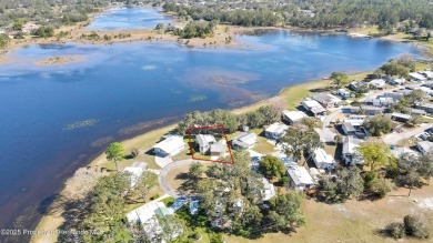 Welcome to paradise!  This lakefront home on Tooke Lake is on Glen Lakes Country Club in Florida - for sale on GolfHomes.com, golf home, golf lot