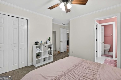 This stunning home in the prestigious gated with security guard on Whitewater Creek in Georgia - for sale on GolfHomes.com, golf home, golf lot