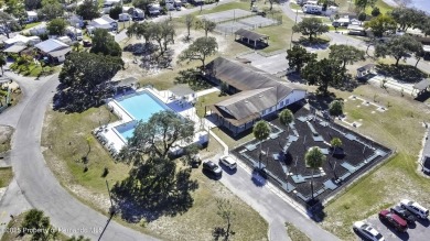 Welcome to paradise!  This lakefront home on Tooke Lake is on Glen Lakes Country Club in Florida - for sale on GolfHomes.com, golf home, golf lot