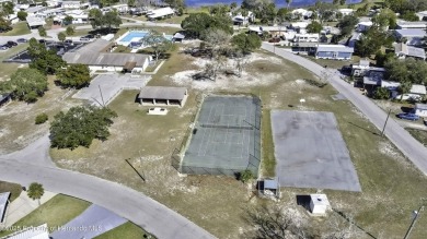 Welcome to paradise!  This lakefront home on Tooke Lake is on Glen Lakes Country Club in Florida - for sale on GolfHomes.com, golf home, golf lot