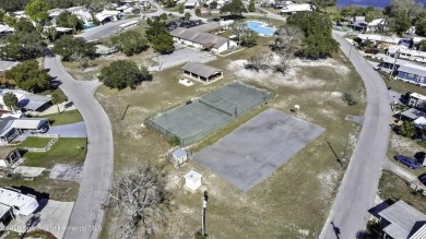 Welcome to paradise!  This lakefront home on Tooke Lake is on Glen Lakes Country Club in Florida - for sale on GolfHomes.com, golf home, golf lot