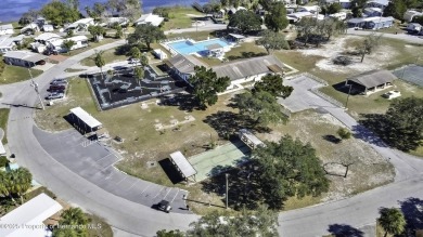 Welcome to paradise!  This lakefront home on Tooke Lake is on Glen Lakes Country Club in Florida - for sale on GolfHomes.com, golf home, golf lot