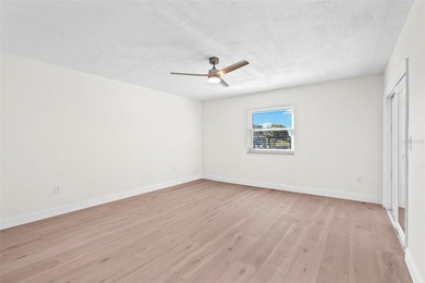 Welcome to 4448 Marine Parkway - Your Waterfront Dream Home on Gulf Harbors Golf Course in Florida - for sale on GolfHomes.com, golf home, golf lot