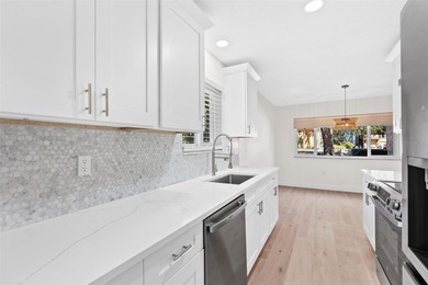 Welcome to 4448 Marine Parkway - Your Waterfront Dream Home on Gulf Harbors Golf Course in Florida - for sale on GolfHomes.com, golf home, golf lot