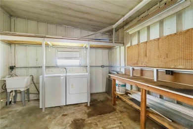 Welcome to this exquisitely remodeled residence in the highly on Twin Isles Country Club in Florida - for sale on GolfHomes.com, golf home, golf lot