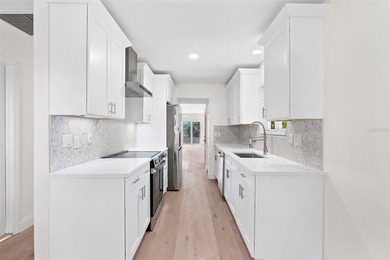 Welcome to 4448 Marine Parkway - Your Waterfront Dream Home on Gulf Harbors Golf Course in Florida - for sale on GolfHomes.com, golf home, golf lot