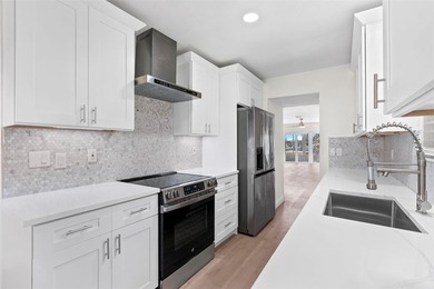 Welcome to 4448 Marine Parkway - Your Waterfront Dream Home on Gulf Harbors Golf Course in Florida - for sale on GolfHomes.com, golf home, golf lot