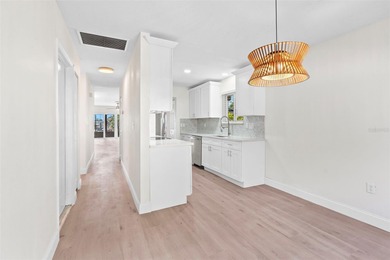 Welcome to 4448 Marine Parkway - Your Waterfront Dream Home on Gulf Harbors Golf Course in Florida - for sale on GolfHomes.com, golf home, golf lot