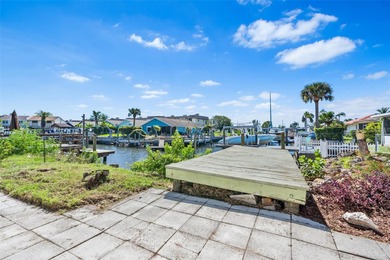 Welcome to 4448 Marine Parkway - Your Waterfront Dream Home on Gulf Harbors Golf Course in Florida - for sale on GolfHomes.com, golf home, golf lot