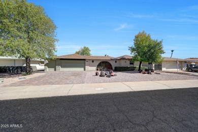 The Brick Driveway Welcomes You To An Enclosed Courtyard on Sun City Lakes West and East in Arizona - for sale on GolfHomes.com, golf home, golf lot