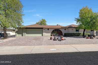 The Brick Driveway Welcomes You To An Enclosed Courtyard on Sun City Lakes West and East in Arizona - for sale on GolfHomes.com, golf home, golf lot