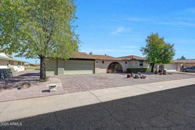 The Brick Driveway Welcomes You To An Enclosed Courtyard on Sun City Lakes West and East in Arizona - for sale on GolfHomes.com, golf home, golf lot