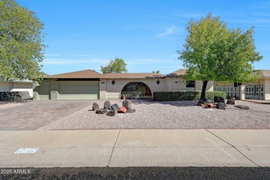 The Brick Driveway Welcomes You To An Enclosed Courtyard on Sun City Lakes West and East in Arizona - for sale on GolfHomes.com, golf home, golf lot