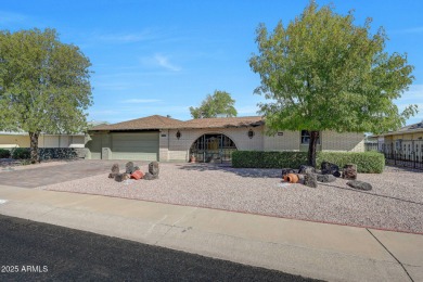 The Brick Driveway Welcomes You To An Enclosed Courtyard on Sun City Lakes West and East in Arizona - for sale on GolfHomes.com, golf home, golf lot