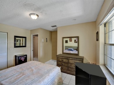 Welcome to your dream condo in the sought-after community of on Woodmont Country Club in Florida - for sale on GolfHomes.com, golf home, golf lot