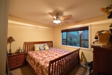 Welcome to this charming home nestled within the private, gated on Holly Lake Ranch Golf Club in Texas - for sale on GolfHomes.com, golf home, golf lot