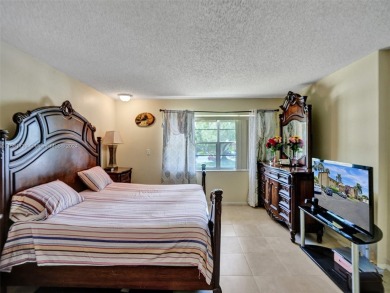 Welcome to your dream condo in the sought-after community of on Woodmont Country Club in Florida - for sale on GolfHomes.com, golf home, golf lot