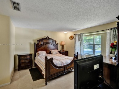 Welcome to your dream condo in the sought-after community of on Woodmont Country Club in Florida - for sale on GolfHomes.com, golf home, golf lot