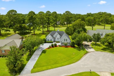 Nestled within a prestigious golf community, this immaculate on Wedgefield Plantation Golf Club in South Carolina - for sale on GolfHomes.com, golf home, golf lot