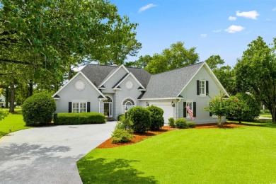 Nestled within a prestigious golf community, this immaculate on Wedgefield Plantation Golf Club in South Carolina - for sale on GolfHomes.com, golf home, golf lot