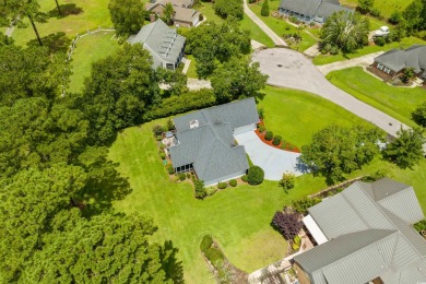 Nestled within a prestigious golf community, this immaculate on Wedgefield Plantation Golf Club in South Carolina - for sale on GolfHomes.com, golf home, golf lot