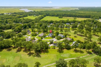 Nestled within a prestigious golf community, this immaculate on Wedgefield Plantation Golf Club in South Carolina - for sale on GolfHomes.com, golf home, golf lot