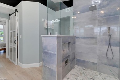 Step into over 2,100 square feet of beautifully remodeled luxury on Olde Hickory Golf and Country Club in Florida - for sale on GolfHomes.com, golf home, golf lot