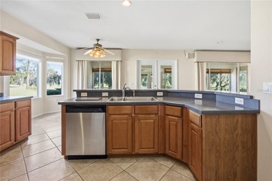 Serenity awaits in this inviting Madeira model, perfectly on Eagle Ridge At Spruce Creek Country Club in Florida - for sale on GolfHomes.com, golf home, golf lot