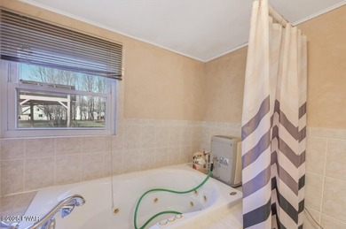 Contemporary Retreat with In-Law Suite & Premier Amenities in on The Hideout Golf in Pennsylvania - for sale on GolfHomes.com, golf home, golf lot