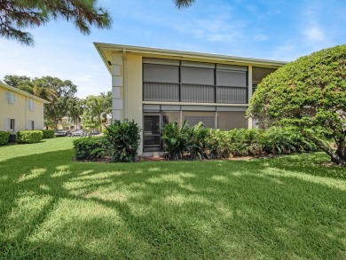 Rarely Available First Floor End Unit with views of the 7th hole on The Golf Club of Jupiter in Florida - for sale on GolfHomes.com, golf home, golf lot