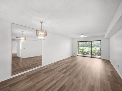 Rarely Available First Floor End Unit with views of the 7th hole on The Golf Club of Jupiter in Florida - for sale on GolfHomes.com, golf home, golf lot