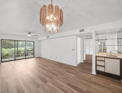 Rarely Available First Floor End Unit with views of the 7th hole on The Golf Club of Jupiter in Florida - for sale on GolfHomes.com, golf home, golf lot