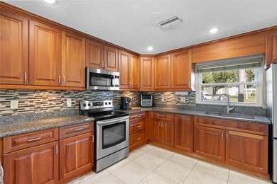 Welcome home to Mediterranean Manor, an idyllic waterfront on The Dunedin Country Club in Florida - for sale on GolfHomes.com, golf home, golf lot