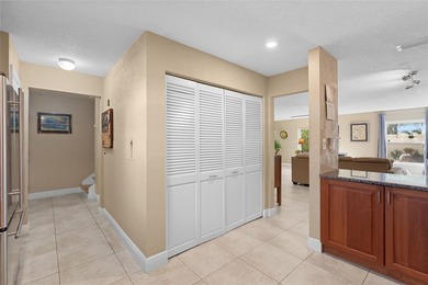 Welcome home to Mediterranean Manor, an idyllic waterfront on The Dunedin Country Club in Florida - for sale on GolfHomes.com, golf home, golf lot